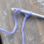 Yo, draw yarn from left to right into the loop on hook